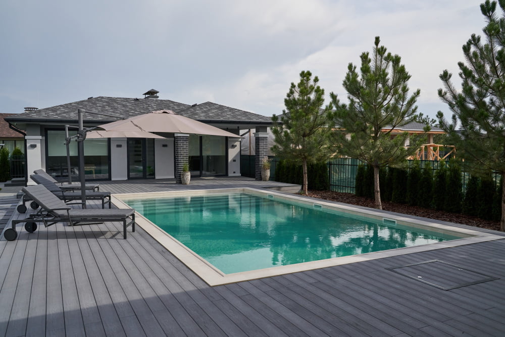 deck in house pool with trees